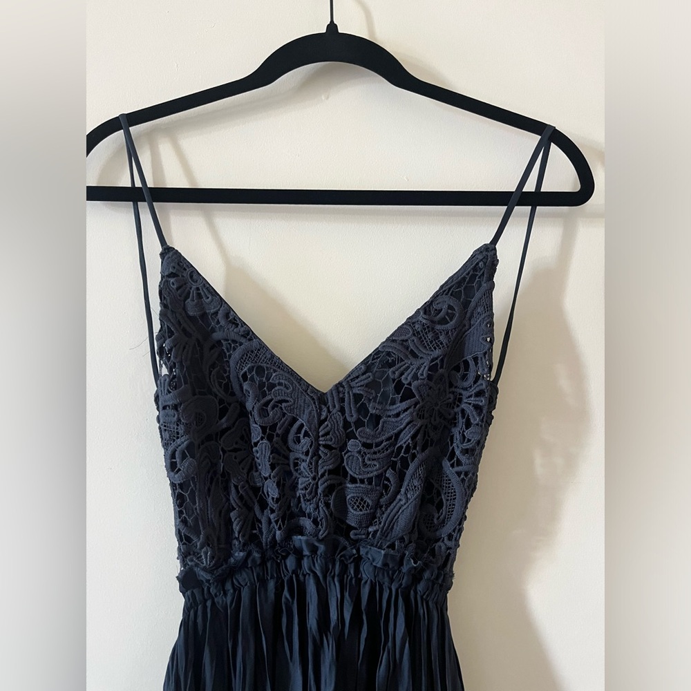 Long, low back blue dress with asymmetrical hem